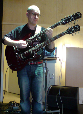 Kent, playing his double necked guitar with Dame Wiggens in February, 2008